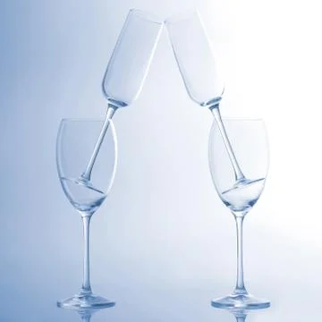Four empty wine glass on a light blue background Stock Photos
