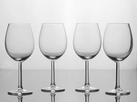 Four empty wine glasses, isolated on white background 写真素材