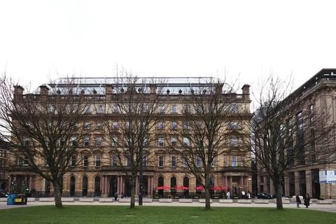 Four Equidistant Leafless Trees Framing a Building Stock Photos