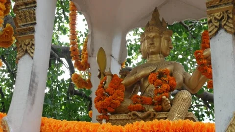 Four-Faced Brahma Statue Adorned at Hindu Shrine Stock Footage 318577917