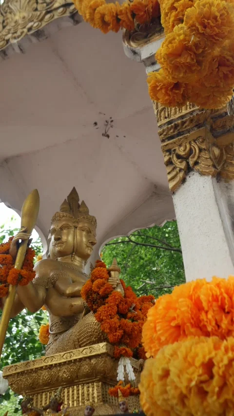 Four-Faced Brahma Statue Adorned at Hindu Shrine Stock Footage 318577926