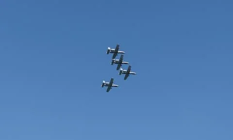 Four fighter jet in V shape in sky. Squadron. Air Force Day. Aircraft squadron Stock Photos