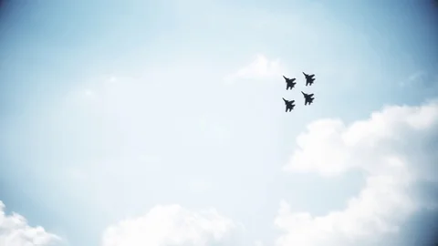 Four fighter jets in the blue sky. A general plan. Aerobatic figures. Airshow Stock Footage 124139426