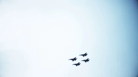 Four fighter jets in the blue sky. A general plan. Aerobatic figures. Airshow Stock Footage 124143251