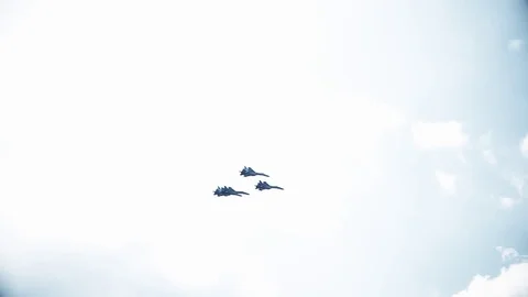 Four fighter jets in the blue sky. A general plan. Aerobatic figures. Airshow Stock Footage 124143517