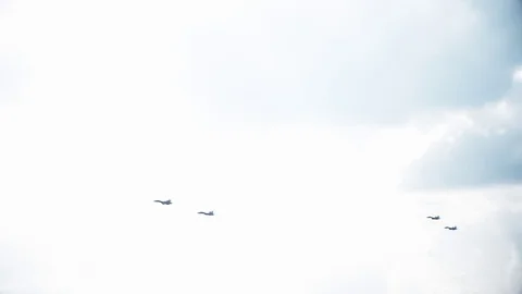 Four fighter jets in the blue sky. A general plan. Aerobatic figures. Airshow Stock Footage 124143640