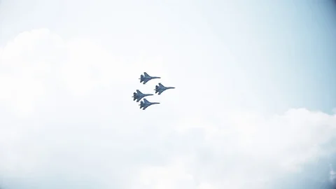 Four fighter jets in the blue sky. A general plan. Aerobatic figures. Airshow Stock Footage 124143647