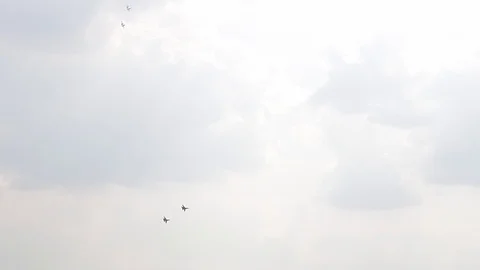 Four fighter jets in the blue sky. A general plan. Aerobatic figures. Airshow Stock Footage 124145943