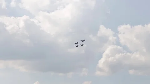 Four fighter jets in the blue sky. A general plan. Aerobatic figures. Airshow Stock Footage 124146827