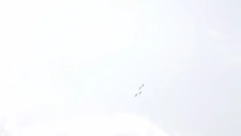 Four fighter jets in the blue sky. A general plan. Aerobatic figures. Airshow Stock Footage 124146863