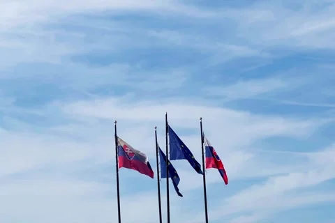 Four flags on masts - Slovakia and the European Union Stock Footage 259625597