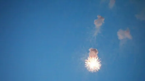 Four flashes of firework in evening sky Stock Footage