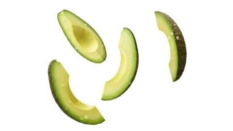 Four floating avocado slices isolated on white Stock Footage 339340856