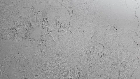 Four frames show the textures and patterns on a gray wall surface in an indoor Stock Footage 329324325