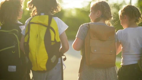 Four Friends Are Going to School. They Have A Lot of Fun Because Today is Their Stock Footage 89936252