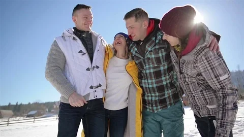 Four Friends are Hugging Each Other on Blue Sky Background. Closeup Portrait of  Stock Footage 72928273