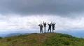 The four friends dancing on the mountain with a picturesque landscape 4k or 4k+ Resolution