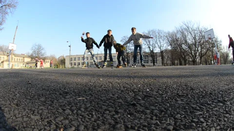 Four friends go by rollers Stock Footage 36784814