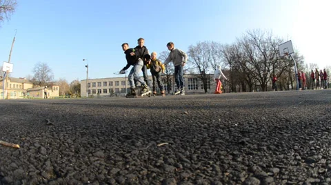 Four friends go by rollers Stock Footage 36784815