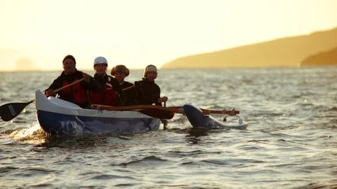 Four friends have fun kayaking on the ocean. Stock Footage 88405705