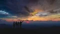 The four friends standing on an evening mountain 4k or 4k+ Resolution
