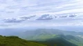 The four friends standing on the mountain against the cloud stream 4k or 4k+ Resolution