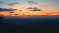 The four friends standing on a mountain with the beautiful sunrise 4k or 4k+ Resolution