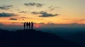 The four friends standing on a mountain with the beautiful sunset 4k or 4k+ Resolution