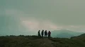 The four friends standing on a mountain top 4k or 4k+ Resolution