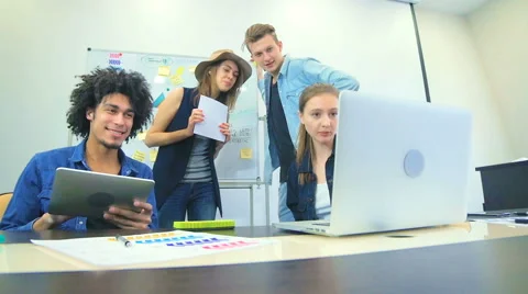 Four friends work together at office Stock Footage 60786910