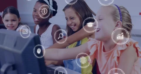 Four girls working in school computer lab, girl in yellow pointing, peers Stock Footage 329931086
