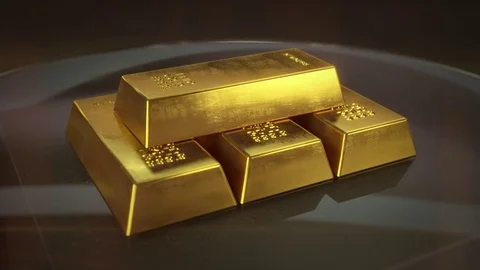 Four Gold Bricks on Glass Table which Rotates 360 Degrees. Stock Footage 81187930