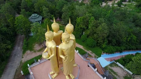 Four golden Buddha Statue Close Up toward, Aerial View from drone at Wat doi sap Stock Footage 224091985