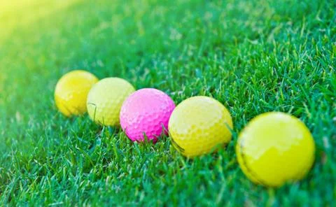 Four golf balls Stock Photos