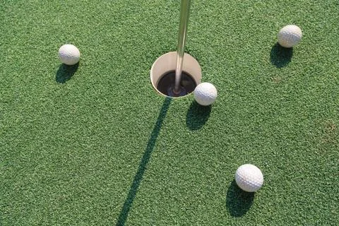 Four golf balls Stock Photos