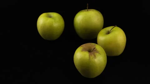 Four green apples against a black background Stock-Footage 331662039
