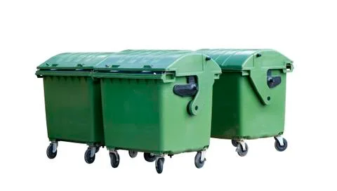 Four green garbage containers Stock Photos