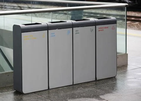 Four grey recycle trash cans with description in Czech and English Stock Photos