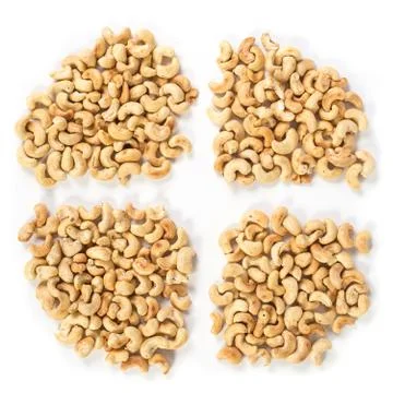 Four groups of roasted cashews Stock Photos