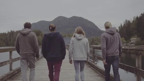 Four guys walking on a dock Stock Footage 81395978