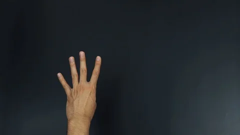 Four hand gesture on black background Stock Footage 90299807