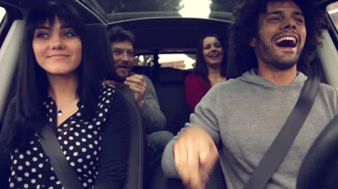 Four happy cool people having fun in car Stock Footage