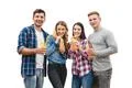 The four happy friends drink cocktails on a white background Photo