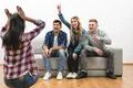 The four happy friends fun on the white wall background Photo