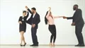 The four happy people dancing on the white background. slow motion 4k or 4k+ Resolution