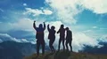 The four happy people standing on a beautiful mountain 4k or 4k+ Resolution