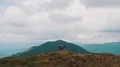 The four hikers standing on the mountain 4k or 4k+ Resolution