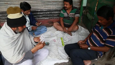 Four Indian Men Casually Play Cards Stock Footage 129108927