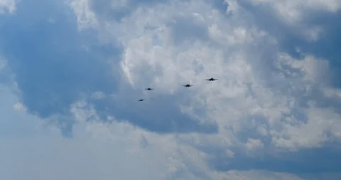 Four jets approach in slow motion to attack and maneuver while flying close up. Stock-Footage 118570201