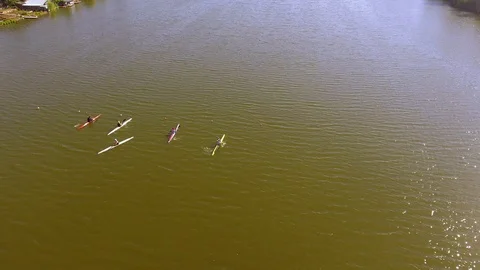 Four kayaks begin to move Stock Footage 109045185